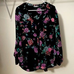 a button up black top with purple red green orange pink and teal flowers